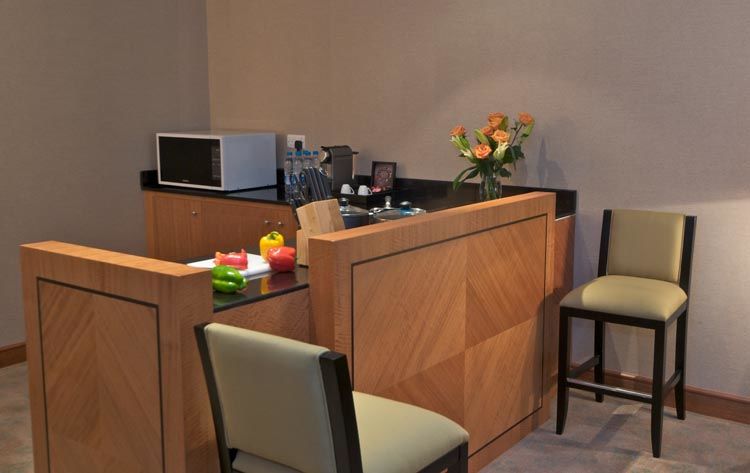 Wiseman Grand Hotel Doha Kültér fotó A small kitchen in a hotel suite