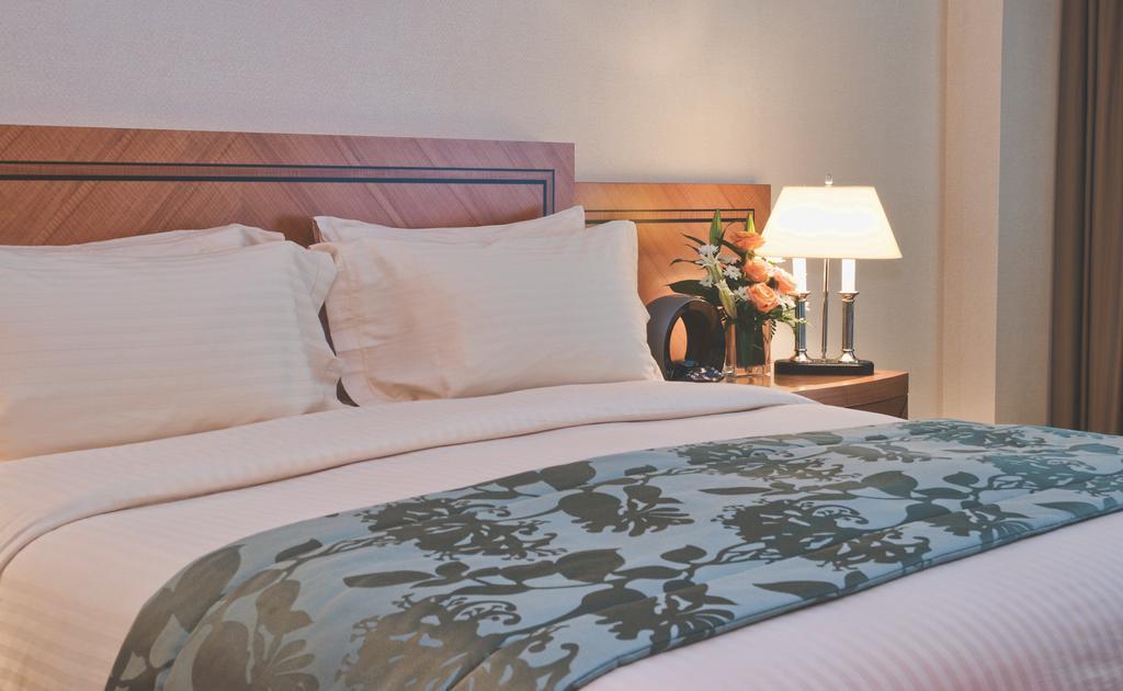 Wiseman Grand Hotel Doha Kültér fotó A bed runner